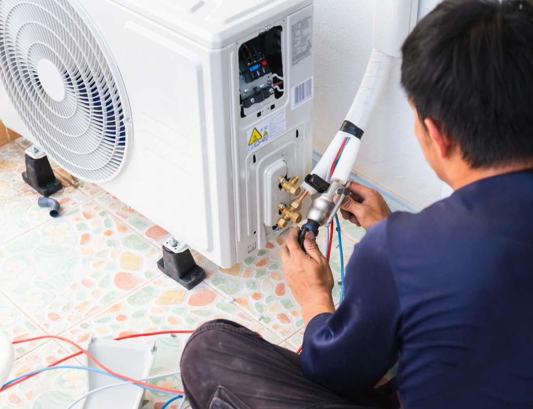 Air conditioning technicians install new air conditioners in homes, Repairman fix air conditioning systems, Male technician service for repair and maintenance of air conditioners